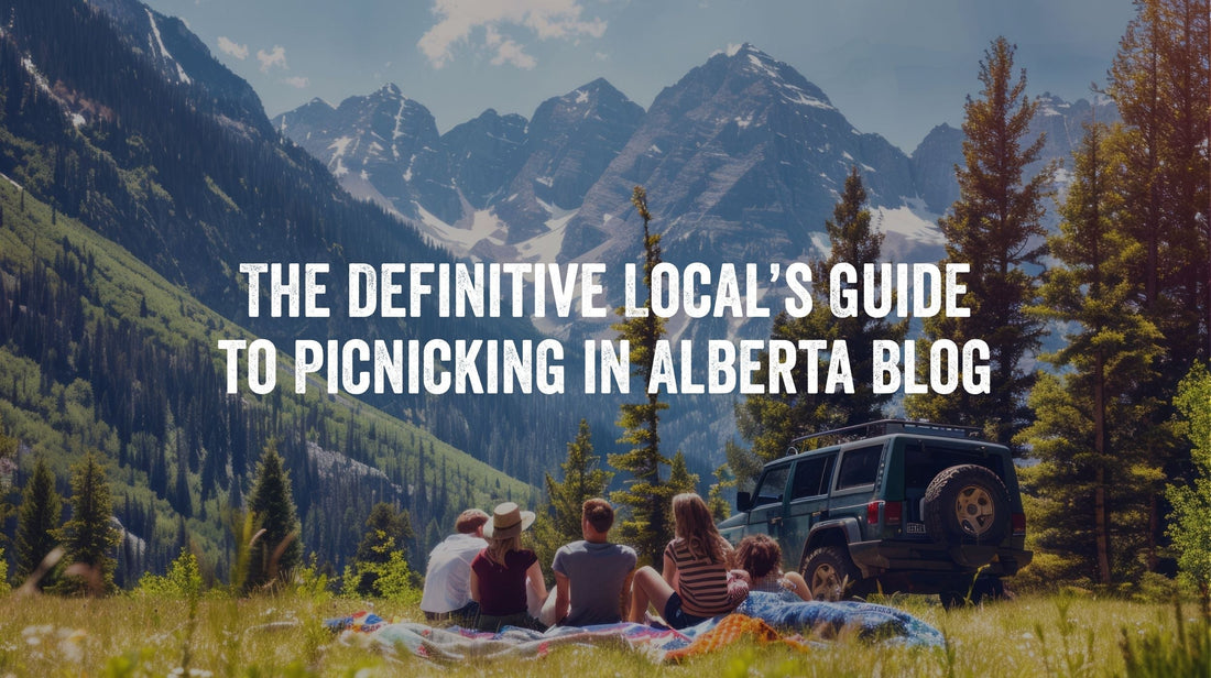 The Definitive Local's Guide to Picknicking in Alberta, photo with group lying on blanket in mountain setting beside jeep